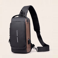 Zwart-bruine DS Lock crossbody tas met cognac zijkant en USB-poort, kleurvariant zwart-bruin