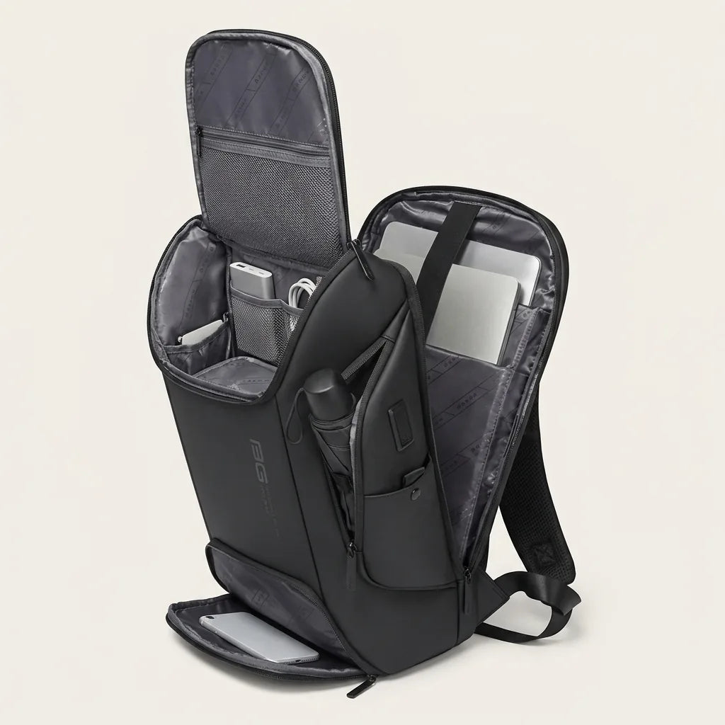 Breed opengeklapte DS Pro rugzak met laptop, powerbank en paraplu toont alle compartimenten